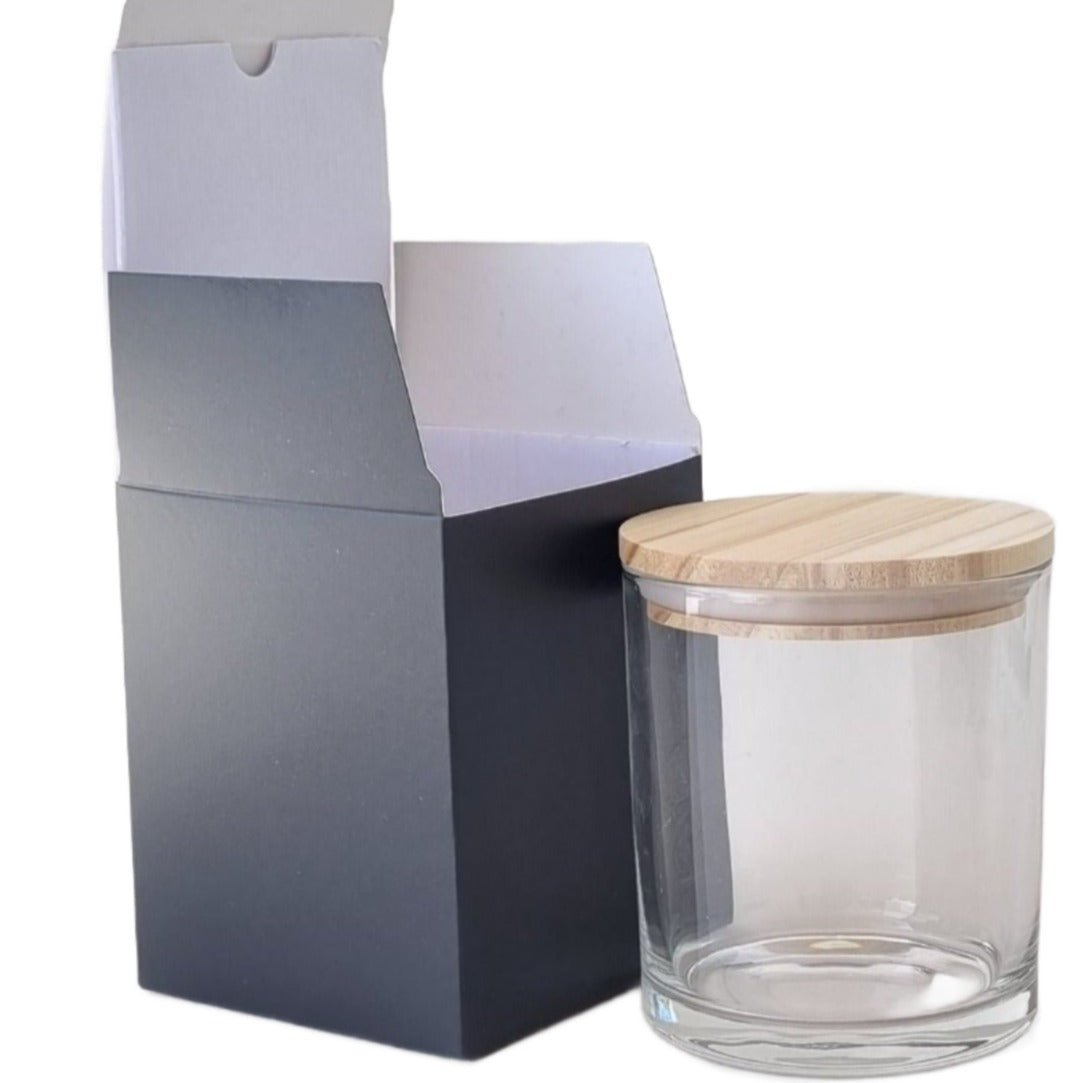 cardboard black packaging for a candle with matching candle container and lid