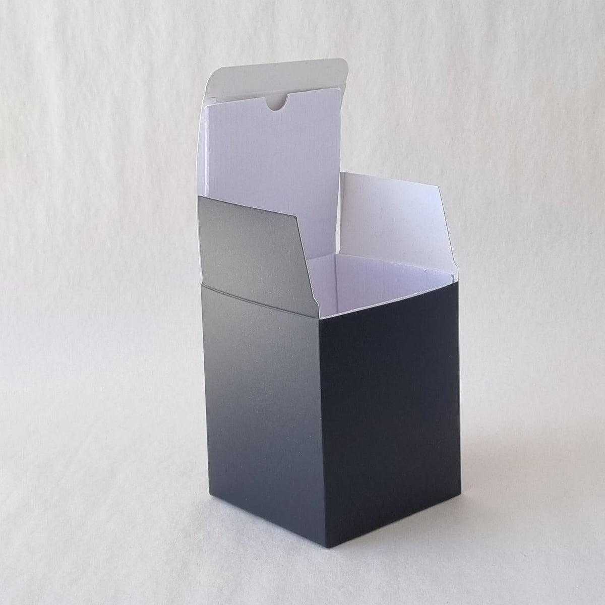 cardboard black box for candles with flap open