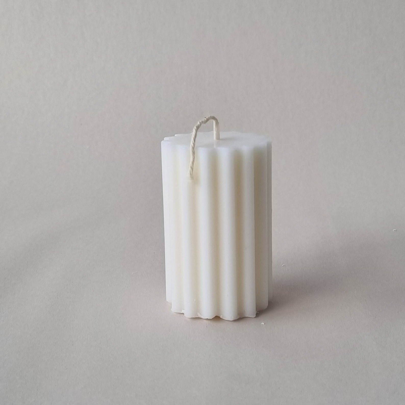 Short wavey fluted column candle mould