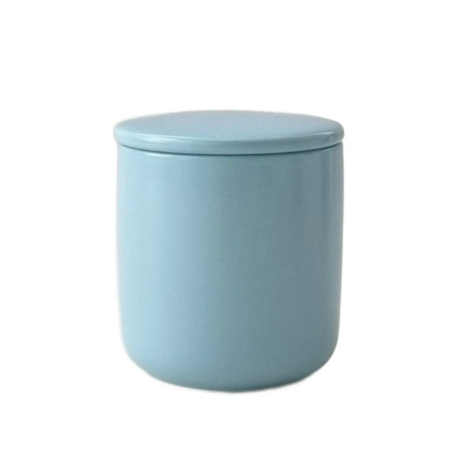 small ceramic jar with matching lid in blue